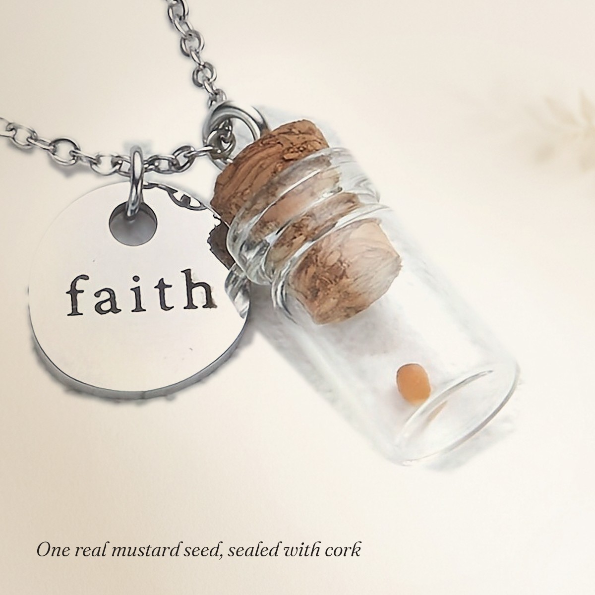 Close-up of the single real mustard seed inside the corked glass vial